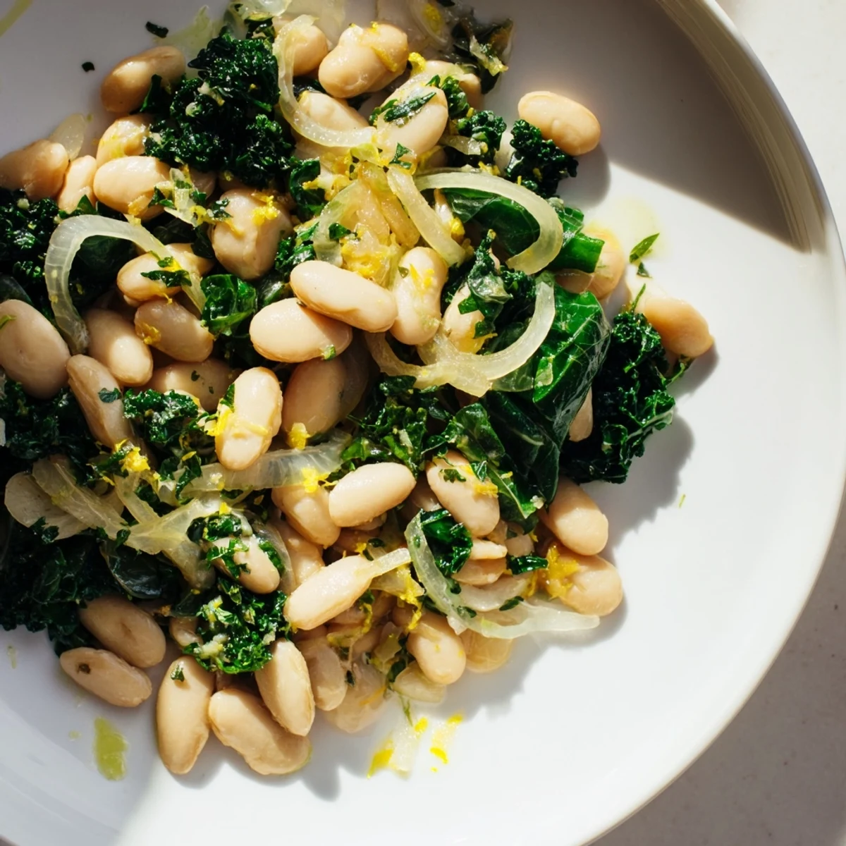 This rustic dish of Garlicky Beans with Winter Greens looks delicious, perfect for a cozy, flavorful meal.