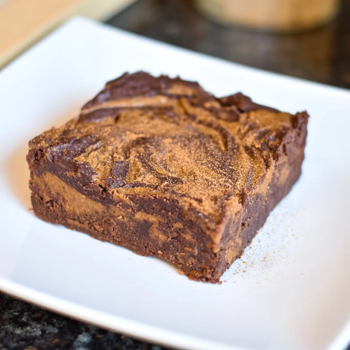 Fudgy, gluten-free Pumpkin Workout Brownies, swirled with a rich chocolate aroma, perfect as a snack.