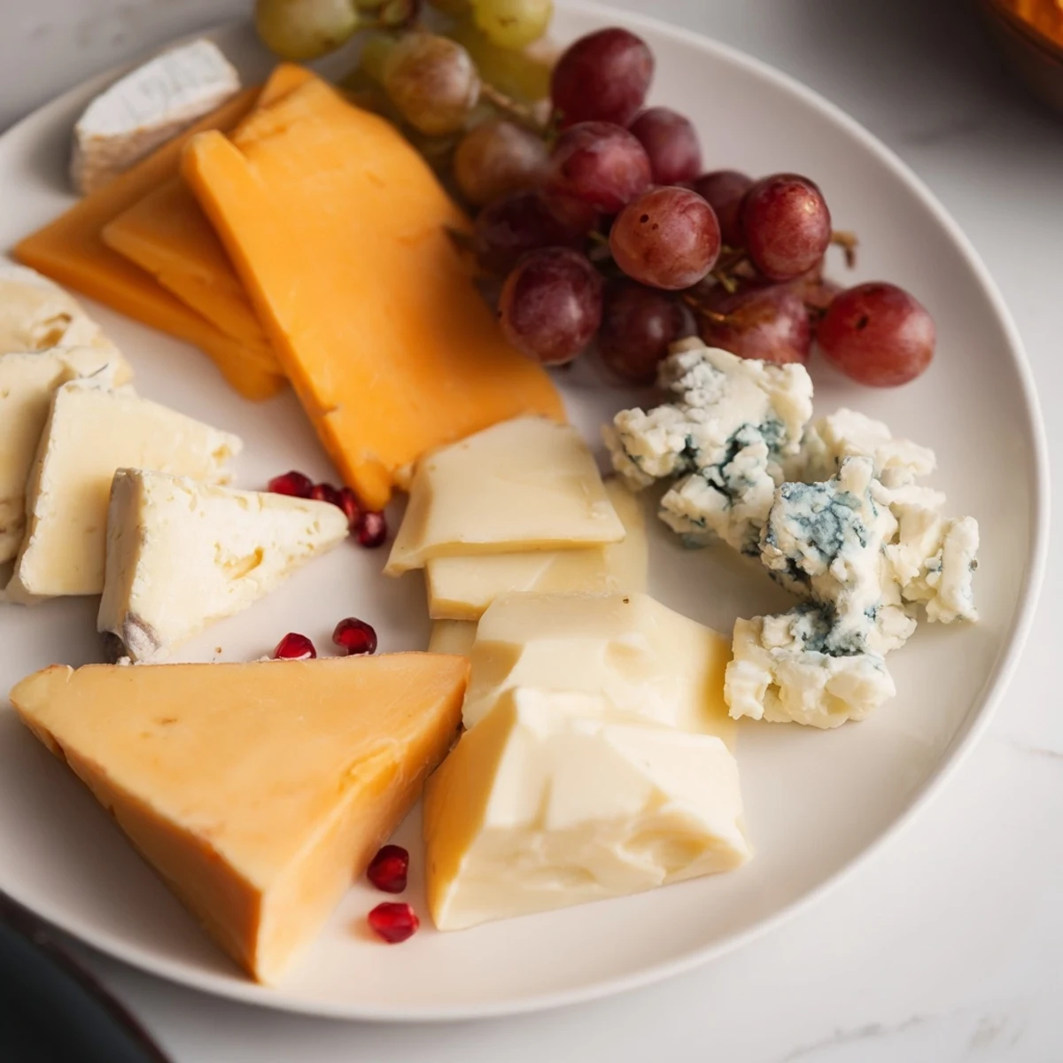 Arranging a delicious Cornucopia Harvest Board, displaying grapes, cheese, and meats for a perfect seasonal appetizer.