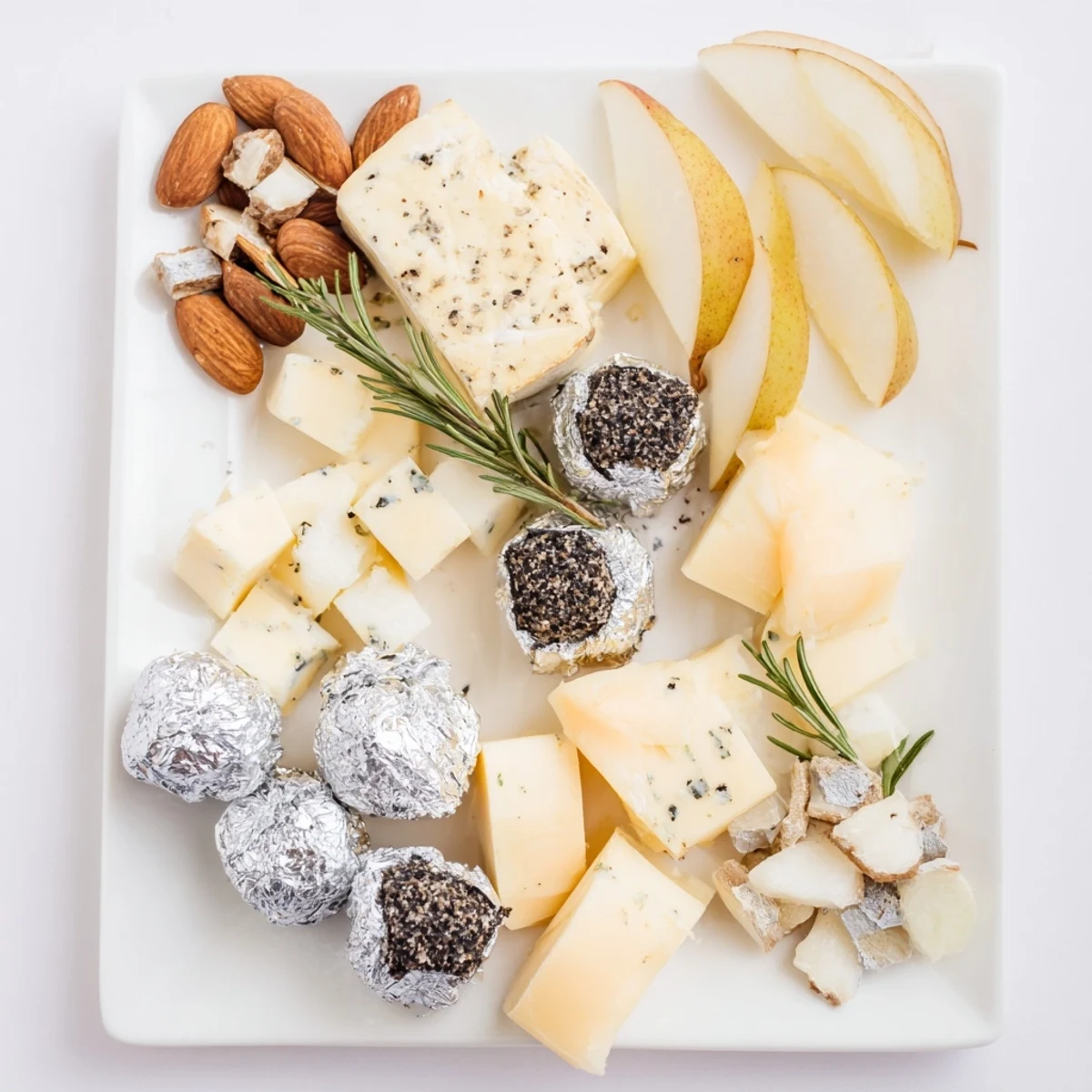 Elegant Silver Screen cheese board featuring creamy truffle brie and shimmering silver chocolates.