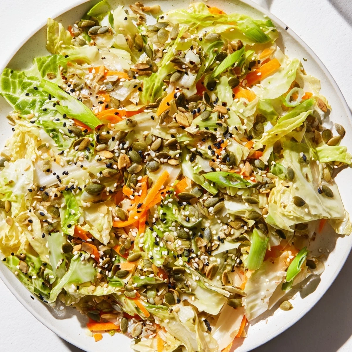 Savory Cabbage-Core Slaw Salad, dressed in a glistening sesame sauce, offers a crisp, satisfying crunch.