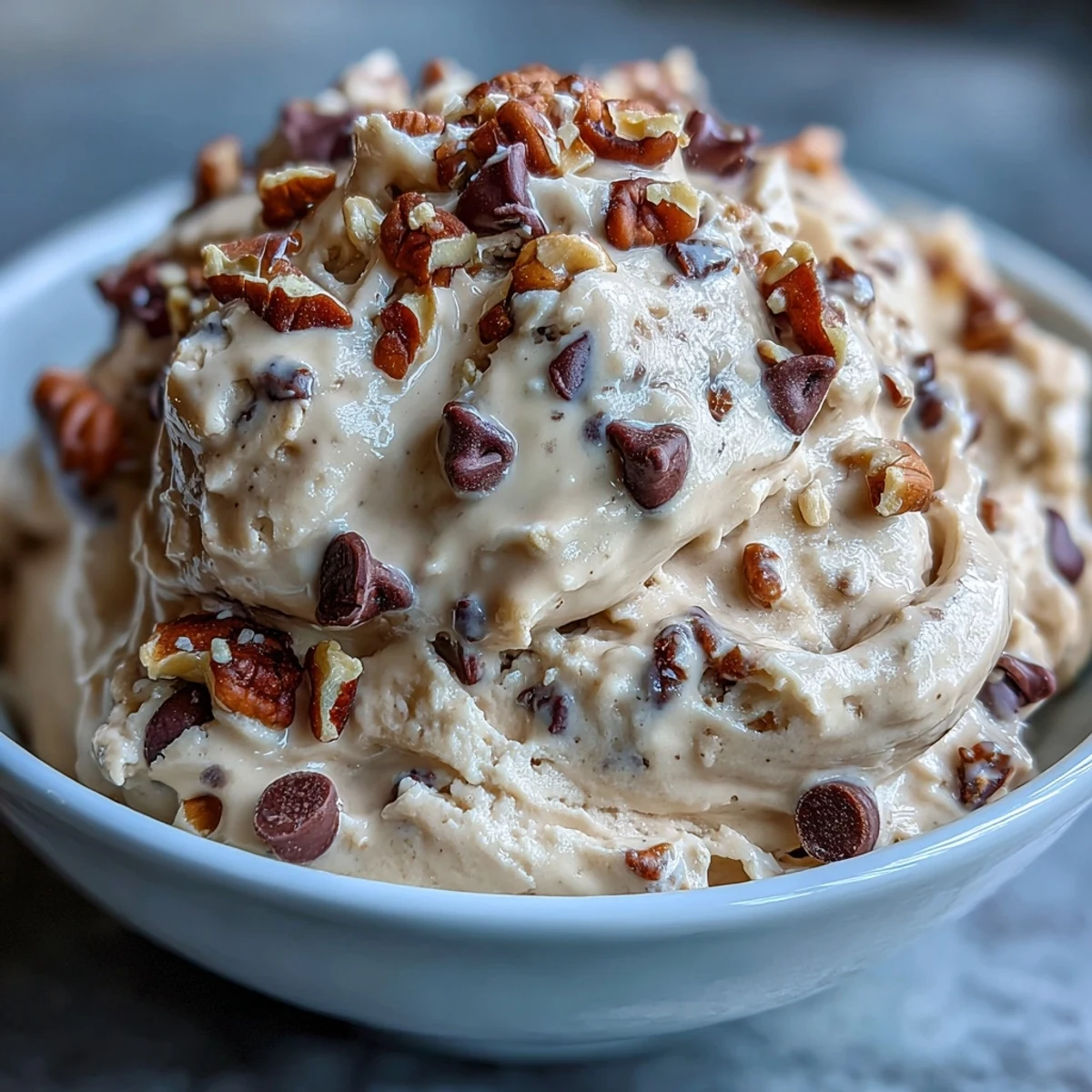 Velvety Greek yogurt mixed with nut butter and oat flour, studded with chocolate chips for a classic cookie dough flavor.  
