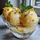 Zesty limoncello sorbet with vibrant citrus aroma, perfect for a light summer dessert.  