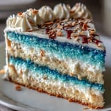 Elegant dark blue and gold ombre cake featuring vanilla buttercream frosting, designed for festive graduation celebrations.