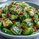 Crisp smashed cucumber avocado salad, a flavorful fusion side bursting with nutty notes.