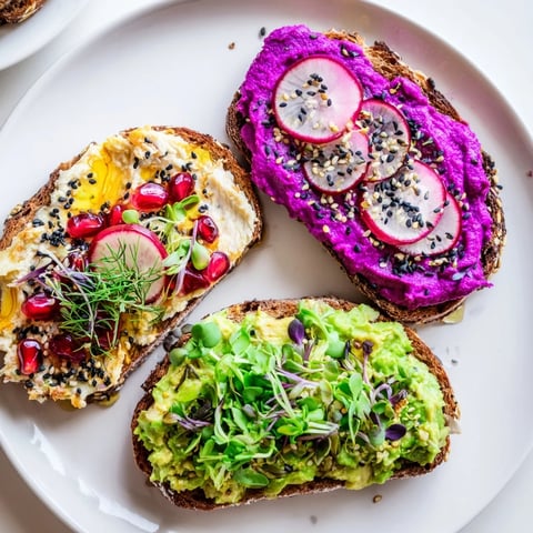Vibrant Bright & Bold Breakfast Toasts topped with ube, avocado, and fresh garnishes.  