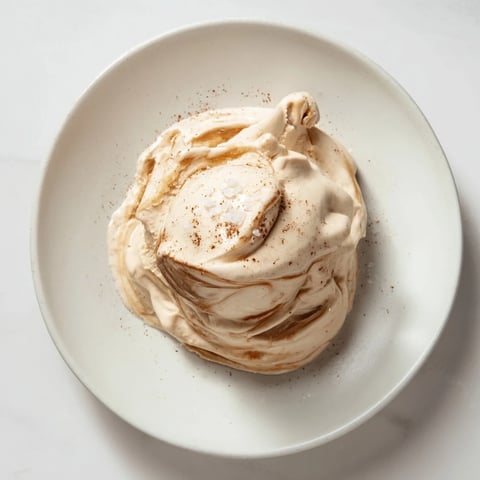 Creamy Peanut Butter Banana Ice Cream swirled with peanut butter, perfect for a cold and healthy dessert.