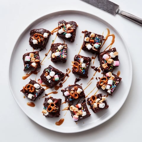 Fluffy Chaos Chocolate Cake Bites speckled with sprinkles and nuts, ready to enjoy.