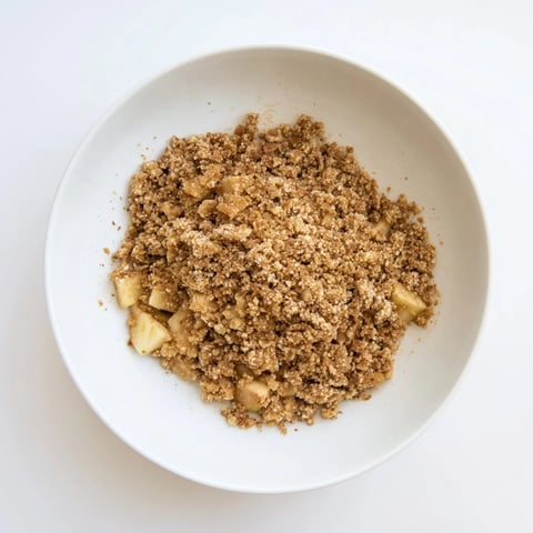Golden-brown Best Apple Crisp bubbling, perfect for a warm dessert with a scoop of vanilla ice cream.