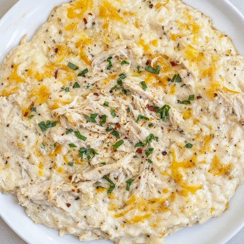 Lightened Marry Me Chicken Dip: A warm, bubbly appetizer with delicious shredded chicken and creamy cheese.