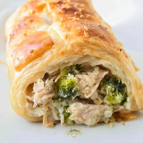 Golden, flaky Creamy Chicken and Broccoli Puff Pastry Rolls, freshly baked and ready to eat.