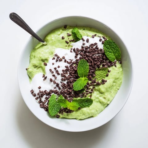 Grinch Green Mint Matcha Breakfast Chia Pudding, layered with creamy yogurt and chocolate chips, ready to enjoy.