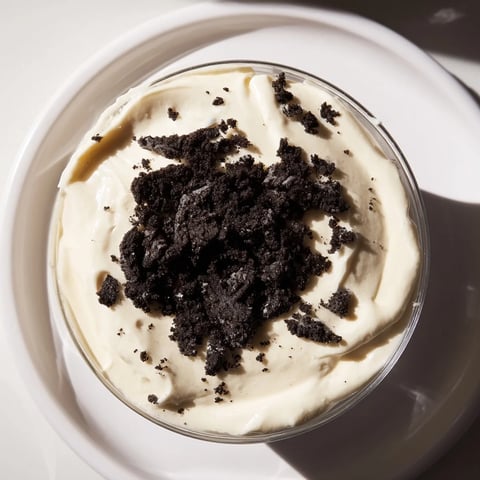A close-up of creamy Vanilla Pudding with Crushed Oreos, layered for a delightful dessert.