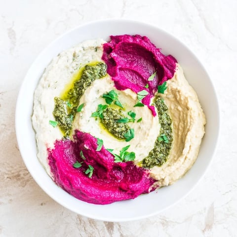 Beautiful marble swirl appetizer, offering vibrant colors of dips and crackers in a stunning arrangement.