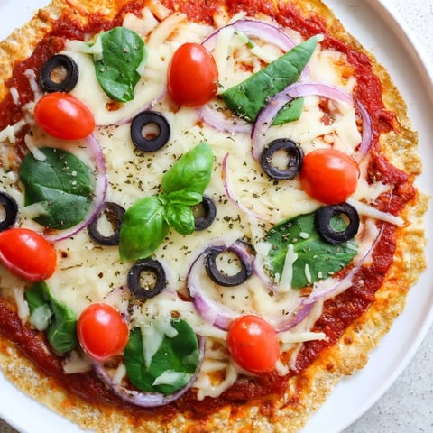 Golden-brown Crispy Tortilla Pizza with melted cheese and fresh basil, ready to eat.