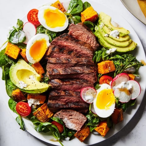 A delicious High-Protein Beef Avocado Bowl featuring juicy steak, creamy avocado, and roasted sweet potato.