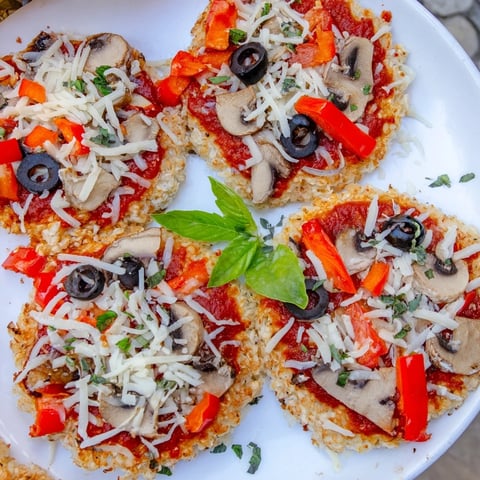 Golden, bubbly Rice Cake Pizza Squares with melted mozzarella, a perfect snack or appetizer.