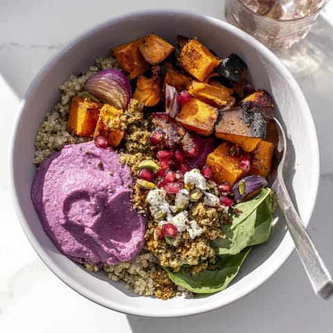 Delicious and colorful spiced winter bowls with quinoa, roasted veggies, and toppings.  