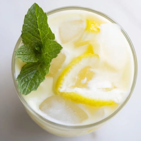 Refreshing Creamy Lemonade Drink, a blend of tart lemon juice and chilled cream, ready to enjoy.