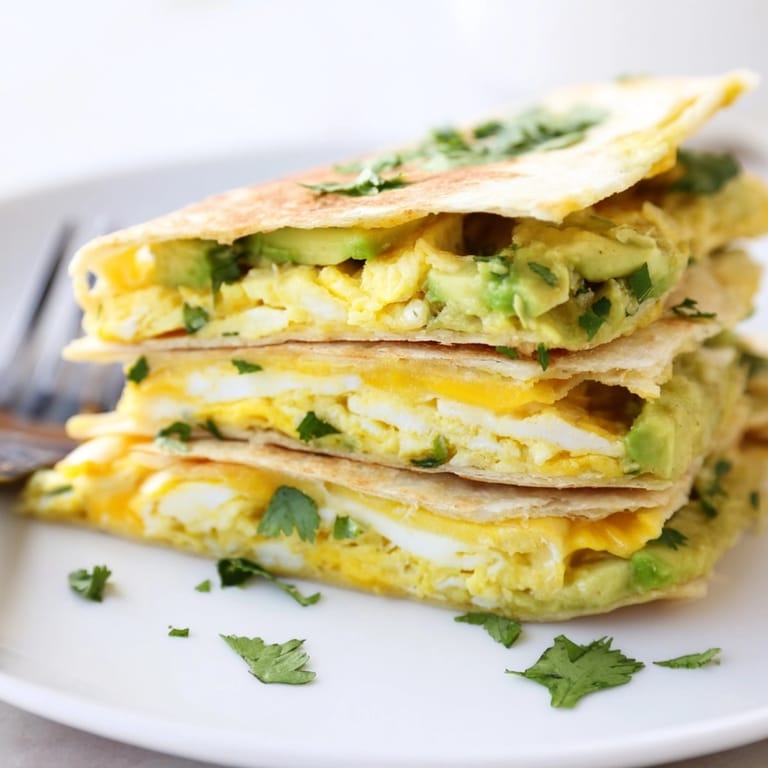 Easy recipe for crispy Avocado Egg Cheddar Quesadillas; a satisfying vegetarian Tex-Mex meal.