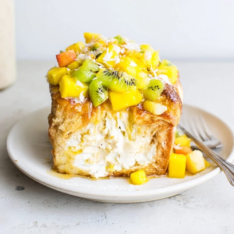 Delicious yogurt-custard toast with mango and pineapple, perfect for brunch gatherings.  