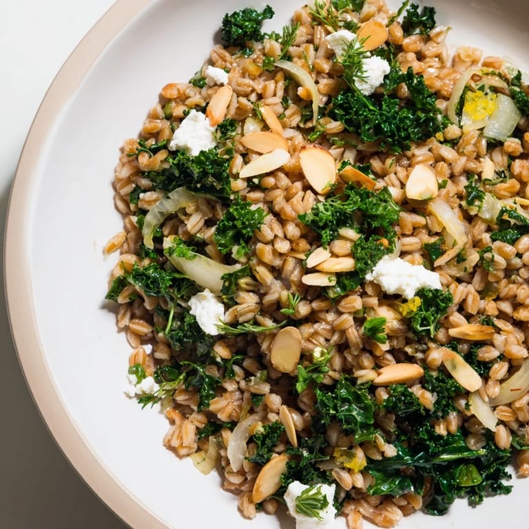 Golden toasted almonds top the warm farro and greens pilaf, a satisfying vegetarian side dish.