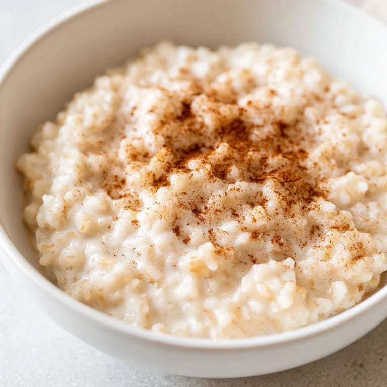 The comforting smell of cinnamon fills the air as this simple rice pudding with leftover rice simmers.