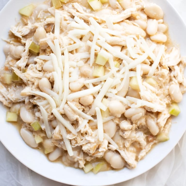 Hearty 35-Minute White Cheddar Apple Chicken Chili: a creamy, savory soup with cooked chicken, white beans.