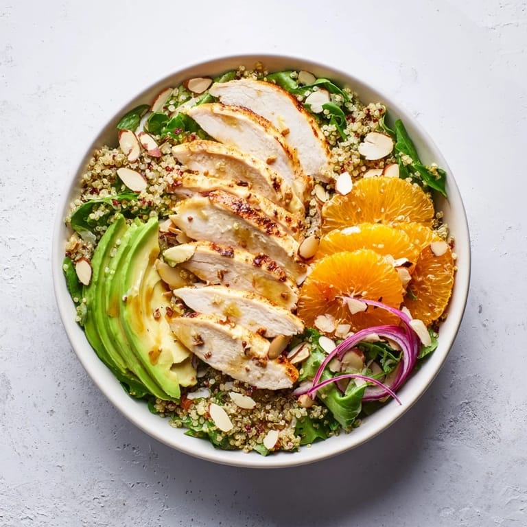 Zesty citrus vinaigrette drizzles over juicy orange segments and sliced almonds in this wholesome bowl.