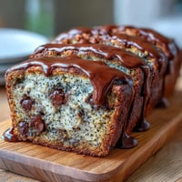 Moist black sesame chocolate chip banana bread loaf with visible chocolate chunks.