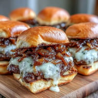 Golden French onion smash burger sliders piled high with melted cheese.